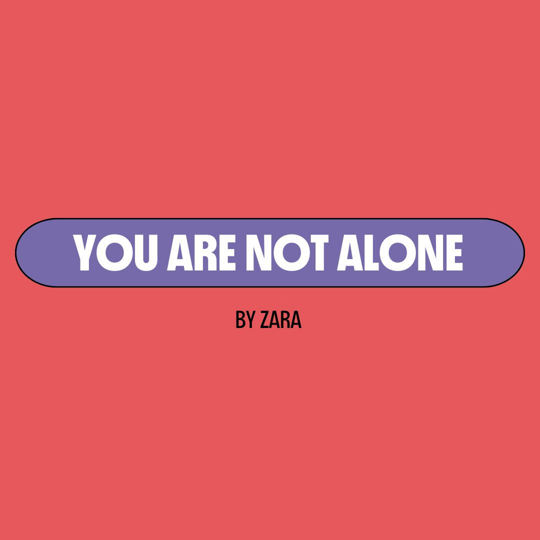 Red background with a purple text box containing white writing that reads: "you are not alone." Underneath is black writing that reads: "by Zara."